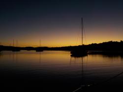 Boat silhouette at sun rise